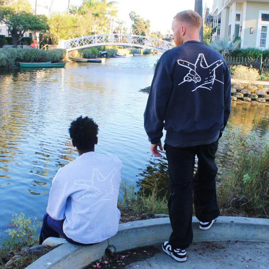 Ash Grey Hands Sweater (left) Dolphin Blue Hands Sweater (right)