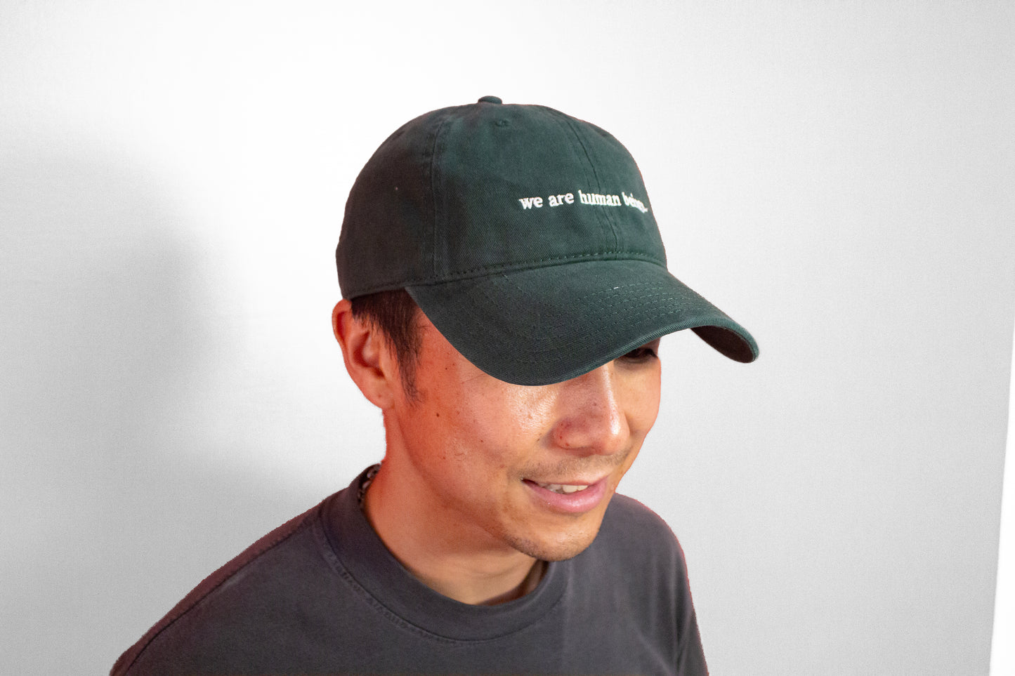 typewriter "we are human beings" hats (now available!)