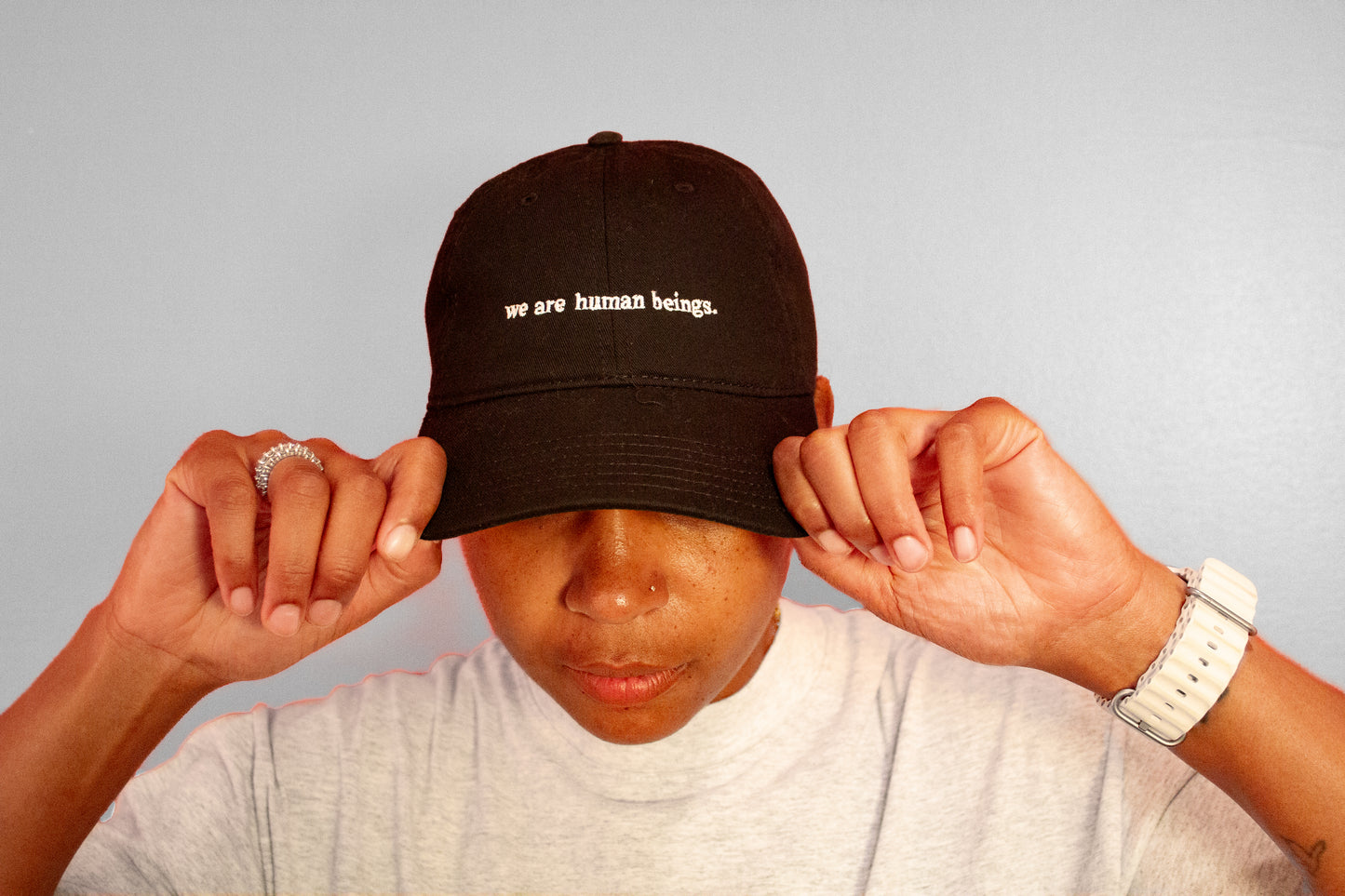 typewriter "we are human beings" hats (now available!)