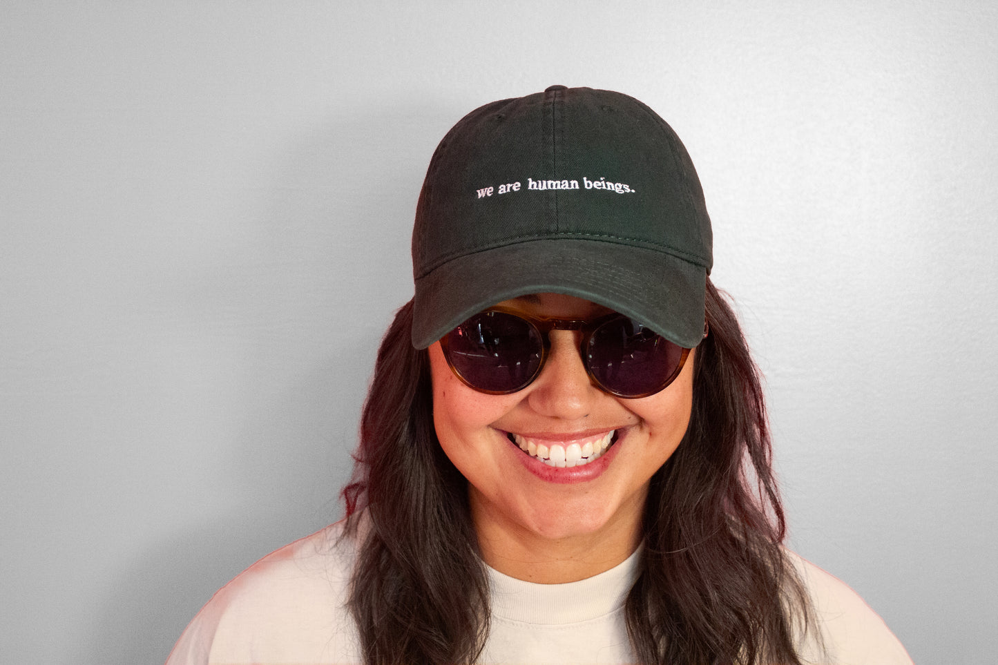 typewriter "we are human beings" hats (now available!)