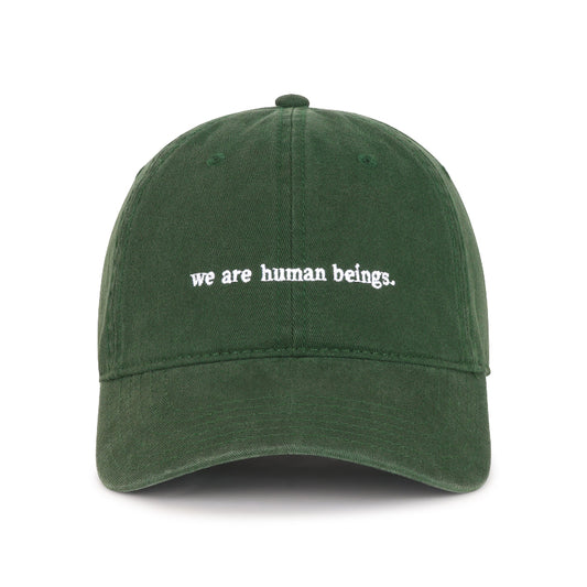 "we are human beings" typewriter hats - green
