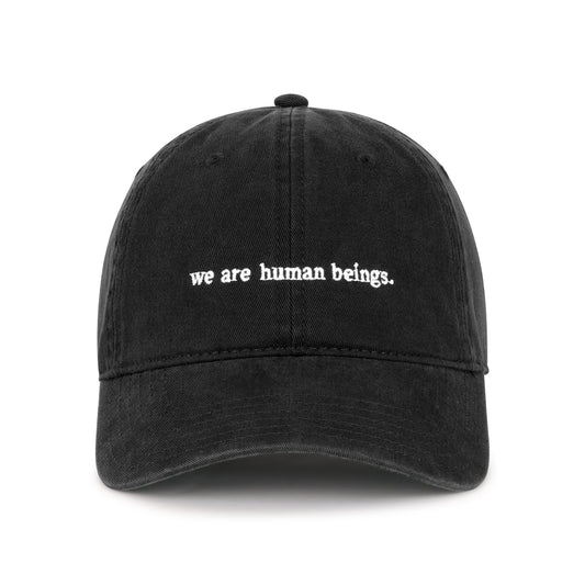 typewriter "we are human beings" hats - black